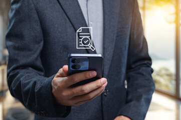 Businessman Checking Document on Smartphone in Modern Office Setting