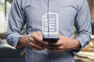 Businessman Checking Document on Smartphone in Modern Office Space