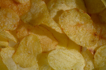 Golden, crispy potato chips arranged in a tempting display ready for snacking during a movie night at home