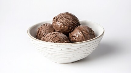 White ceramic bowl filled with scoops of rich chocolate ice cream isolated on white background in close-up