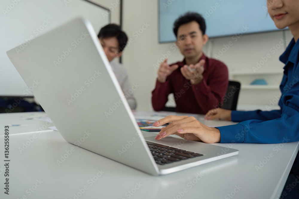 Aufkleber focused discussion and design review. team members discussing ux strategies while referencing digita