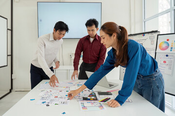 Prototyping and User-Centric Approach. Professionals creating mockups for intuitive user interfaces in a collaborative workspace.