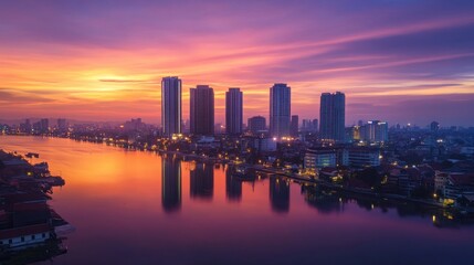 Fototapeta premium Sunrise cityscape, river reflection, urban skyline, vibrant dawn, aerial view
