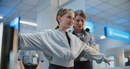 Security Checkpoint in Airport Terminal: Female TSA Officer Checks Girl, Conducts Screening...