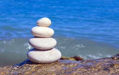 Balance spa stones in the summer beach .