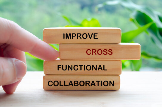 Improve Cross Functional Collaboration text on wooden blocks representing continuous improvement in business strategy
