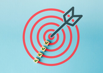 A red and blue circle with a green arrow pointing to a target