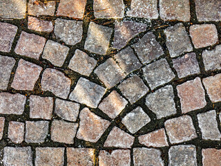 Eis auf Pflastersteinen