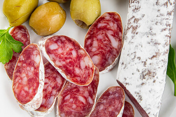 Fuet sausage Spanish meat delicacy fresh delicious gourmet food background on the table rustic food top view copy space
