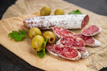 Fuet sausage Spanish meat delicacy fresh delicious gourmet food background on the table rustic food...