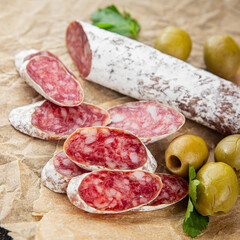 Fuet sausage Spanish meat delicacy fresh delicious gourmet food background on the table rustic food top view copy space
