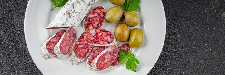 Fuet sausage Spanish meat delicacy fresh delicious gourmet food background on the table rustic food...