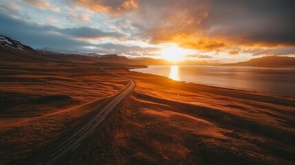 Immerse yourself in the tranquility of Iceland's landscape, featuring stunning coastlines and awe-inspiring mountains at dusk.