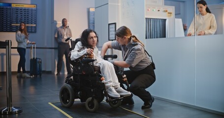 Security Checkpoint in Airport Terminal: Female Security Officer Inspecting Woman in Wheelchair for...