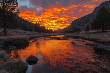 Vibrant sunset reflects on a serene river surrounded by mountains and trees