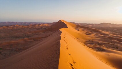 Fototapeta premium Experience the breathtaking beauty of desert dunes illuminated by a stunning sunset sky