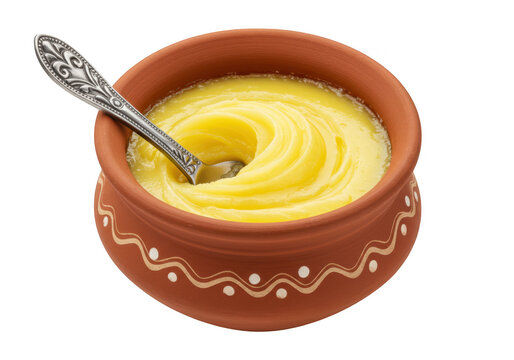 Smooth golden butter ghee in a traditional earthen clay pot isolated on transparent background