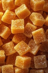A Close-Up View of Delicious Orange-Colored Cubes of Jelly Candy
