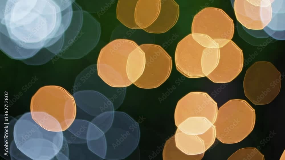 Poster abstract bokeh effect with circular light patterns in green and orange hues. blurred focus creates a