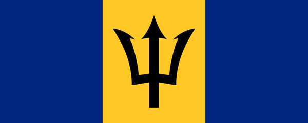 Barbados flag waving proudly against a clear blue sky during a sunny day in the Caribbean