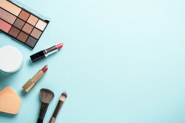 Make up products on blue background.