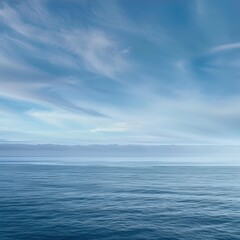 Obraz premium Serene ocean view with soft, blue clouds