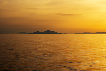 Obraz premium Sunset over the Aegean Sea. Cyclades, Greece
