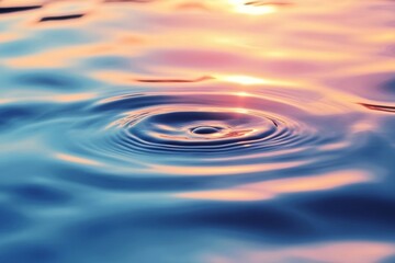 Tranquil water surface reflecting colorful sunlight during a serene evening