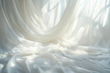 Obraz premium Soft white fabric gently draping with light casting delicate shadows, creating an ethereal atmosphere indoors