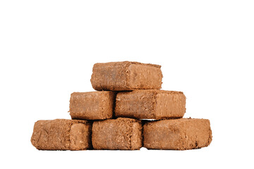 Stack of rectangular compressed wood briquettes made from sawdust, isolated on a transparent background. Eco-friendly fuel for fireplaces, stoves, and heating..