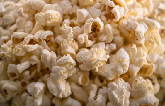Close-up of heap of popcorn - Powered by Adobe