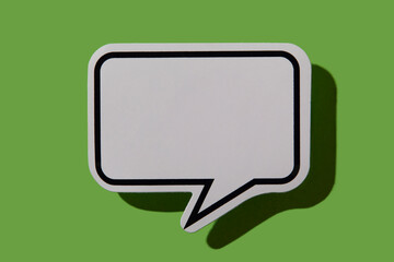 Blank thought bubble on green background