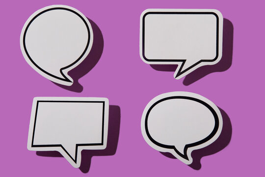 Various blank thought bubbles on purple background