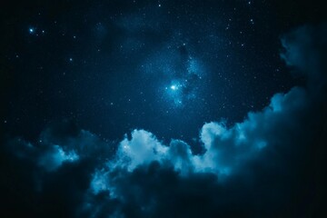 Fototapeta premium Night sky filled with stars and clouds over a serene landscape captures the beauty of the universe