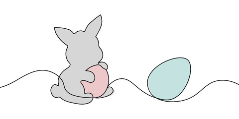 Simple one-line drawing of a bunny holding a pastel pink egg with a blue egg nearby, representing Easter and spring celebrations.  Easter bunny one line icon. Vector illustration