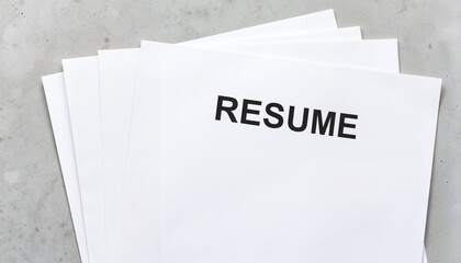 Stack of blank resumes on a gray background  