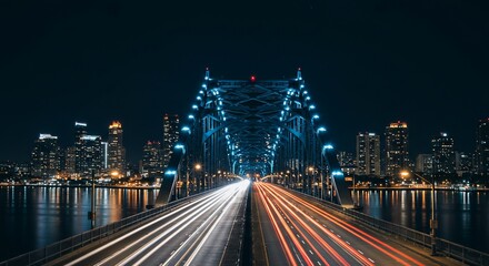 Night cityscape with illuminated bridge and light trails (1)