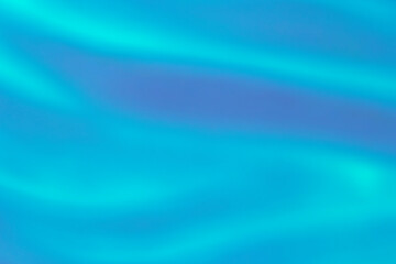 close up of turquoise liquid paint brush strokes