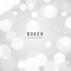 Light gray bokeh background with circular highlights