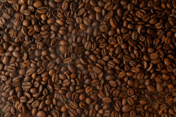 Rich aroma fills the air from freshly roasted coffee beans resting together