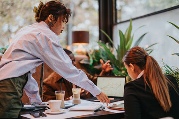 Professionals discuss progress using a graphical presentation in a natural-lit workspace, emphasizing collaboration, analytics, and strategic brainstorming.