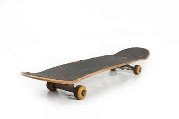Old skateboard isolated on a white background, showing visible wear on the wooden deck, scratched...