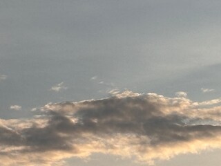 Beautiful sky with natural gradations. Thick clouds in the dusk sky on a winter night. Image of a cloudy sky in the afternoon. View of the night sky with golden light from the evening sun