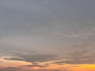 Beautiful sky with natural gradations. Thick clouds in the dusk sky on a winter night. Image of a cloudy sky in the afternoon. View of the night sky with golden light from the evening sun