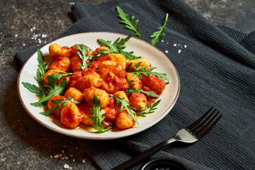 Traditional italian gnocchi with tomato sauce. Horizontal photograph