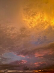 Beautiful sky with natural gradations. Thick clouds in the dusk sky on a winter night. Image of a cloudy sky in the afternoon. View of the night sky with golden light from the evening sun