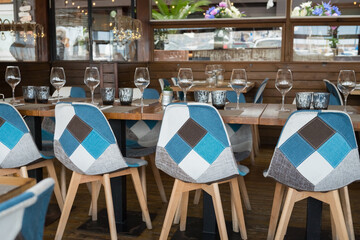 Modern restaurant interior with stylish blue and gray geometric chairs
