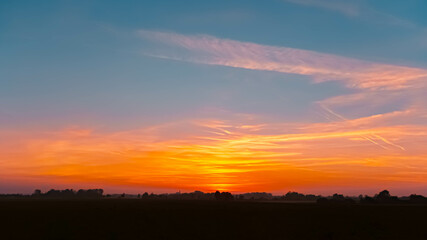Sunset with a church silhouette near Arbing, Osterhofen, Deggendorf, Bavaria, Germany