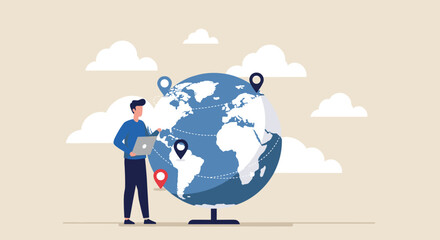 Man working on laptop near a globe, illustrating global reach.