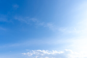 Fototapeta premium Low angle view and full frame of beautiful blue sky with strange shape of white fluffy of clouds in the morning or afternoon on sunny day used as natural background texture in decorative art work